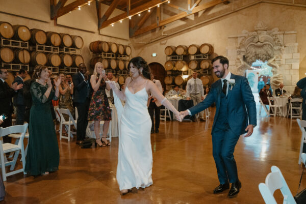 Grand entrance into wine country wedding reception